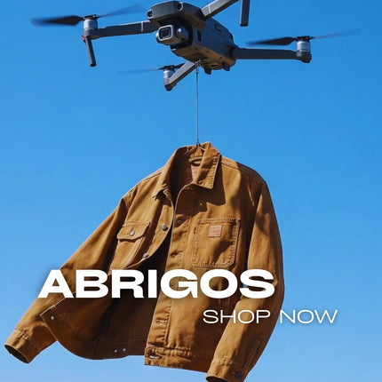 Brown urban jacket hanging from drone in blue sky with 'Abrigos Shop Now' text