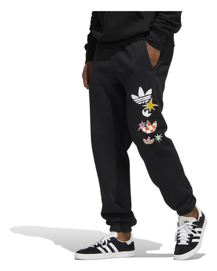 PANTALON DE BUZO ADIDAS ORIGINALS CARTOON GFX SP